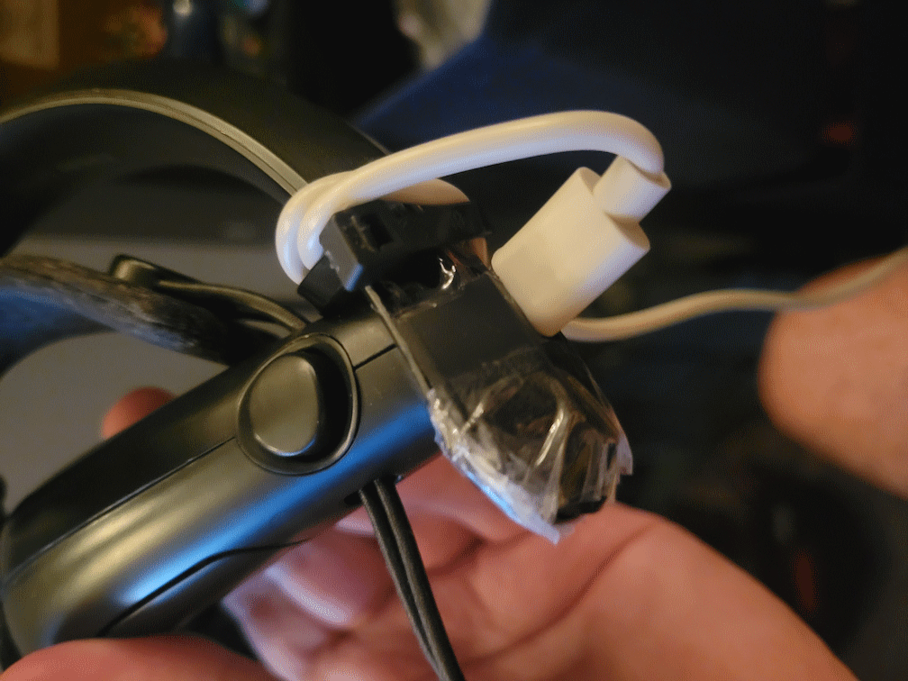 The cable has been ziptied into place so it doesnt wiggle around too much